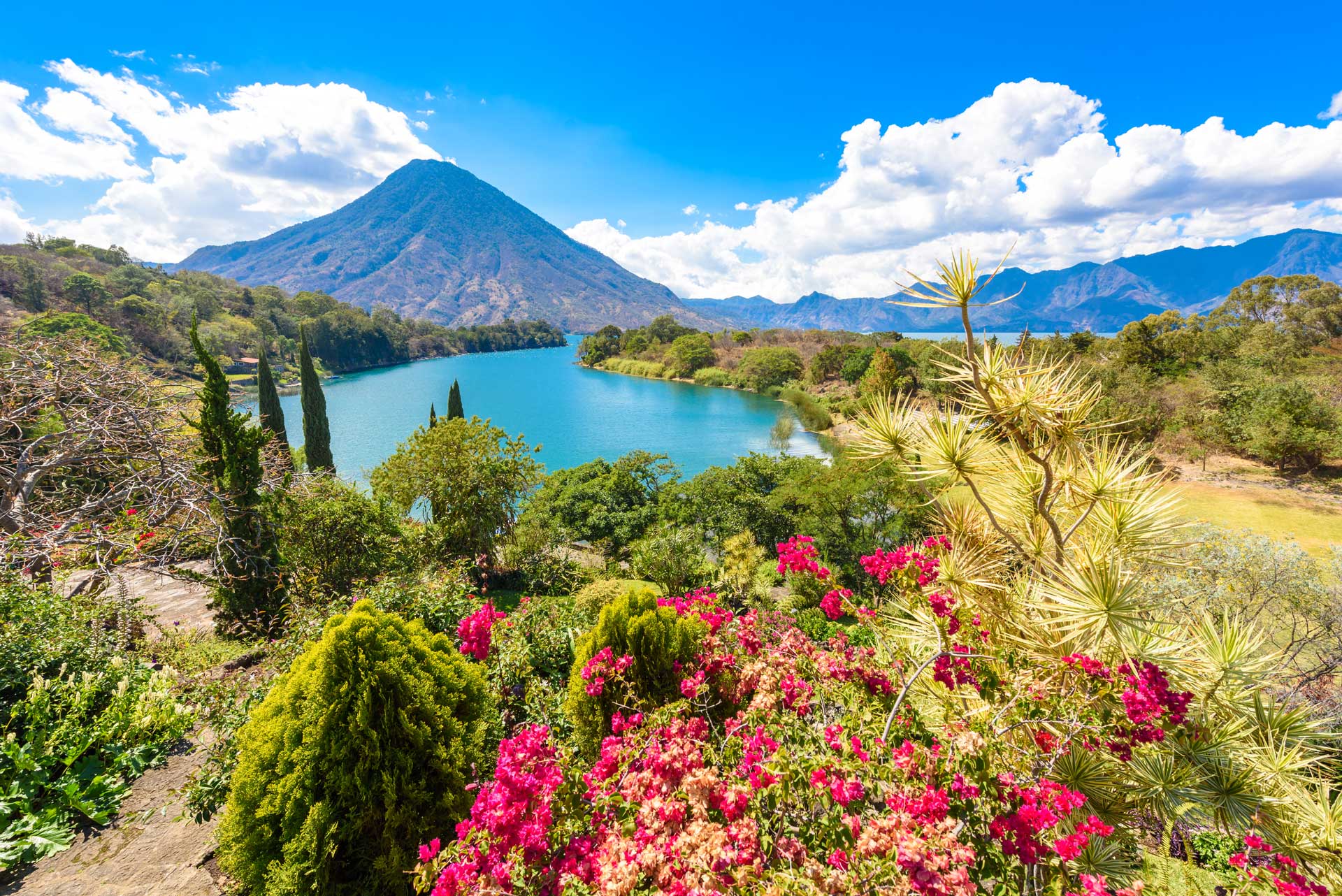 Beautiful bay of Lake Atitlan with view to Volcano San Pedro  in highlands of Guatemala, Central America