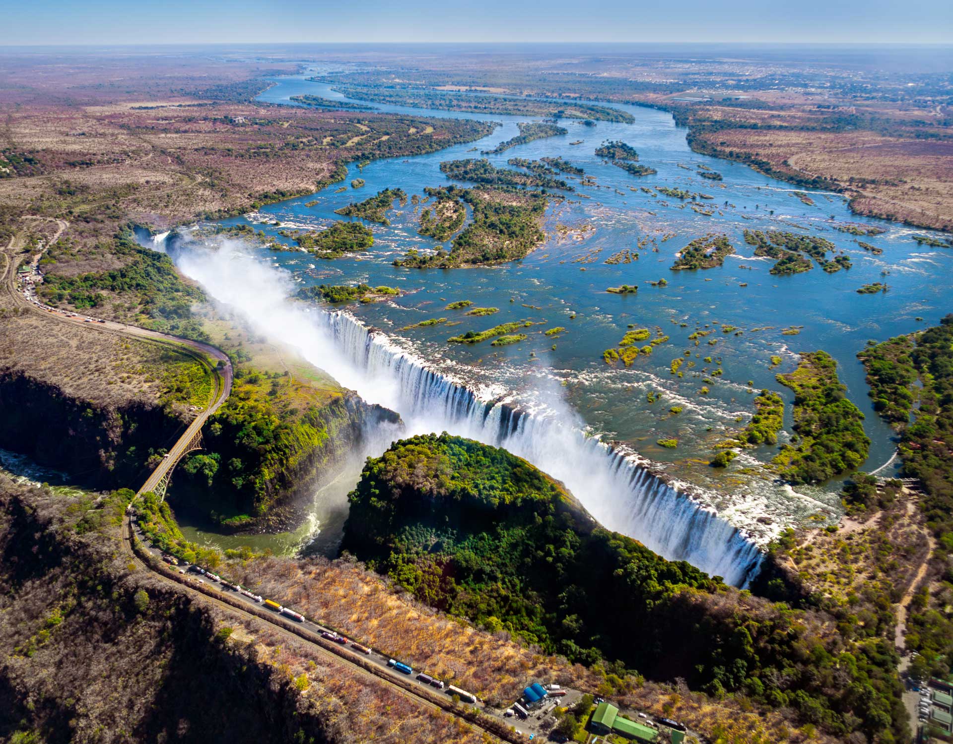 The Victoria falls is the largest curtain of water in the world (1708 m wide). The falls and the surrounding area is the National Parks and World Heritage Site (helicopter view) - Zambia, Zimbabwe