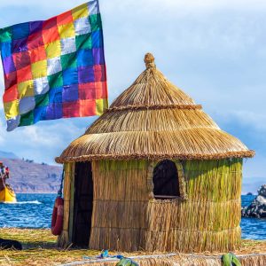 Whiphala flag on a hut on a floating island on Lake Titicaca near Copacabana, Bolivia